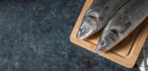 Raw fish arrangement for cooking