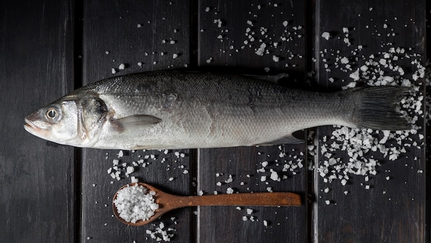 Raw fish arrangement for cooking