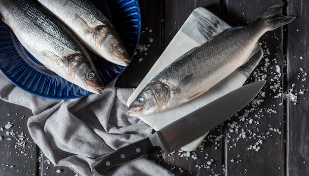 Raw fish arrangement for cooking