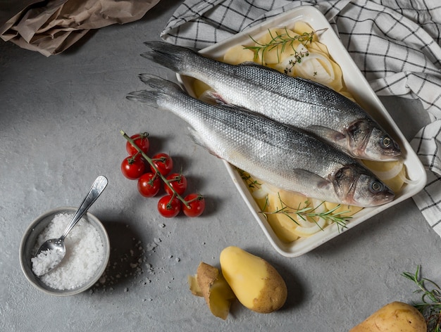 Raw fish arrangement for cooking