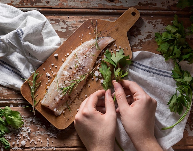 Free photo raw fish with condiments composition for cooking