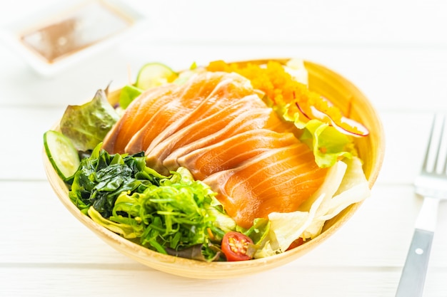 Free Photo raw fresh salmon fish meat sashimi with seaweed