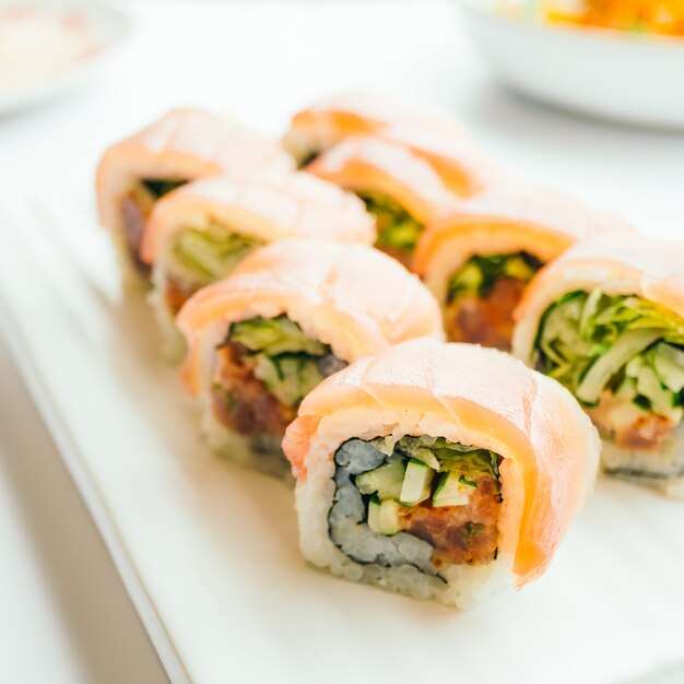 Free photo raw fresh sushi roll with wasabi in white plate