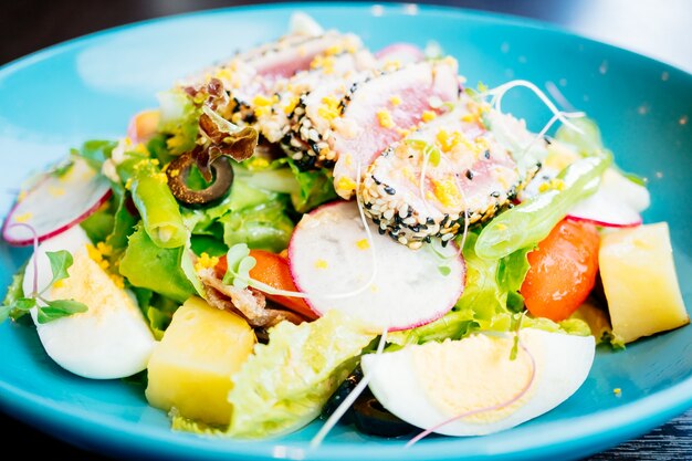 Raw and fresh tuna meat with sesame and salad