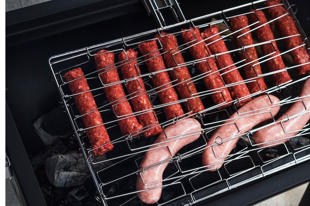 Free photo raw homemade sausages on grill