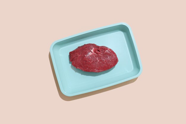 Raw meat on color background