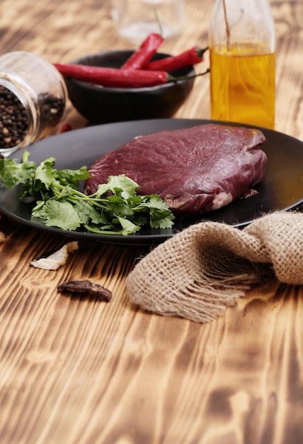 Free Photo raw meat with ingredients for cooking meal