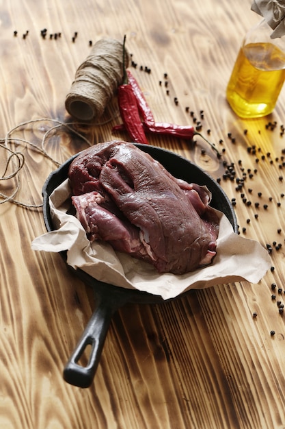 Free photo raw meat with ingredients for cooking meal