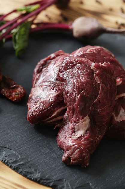 Raw meat with ingredients for cooking meal