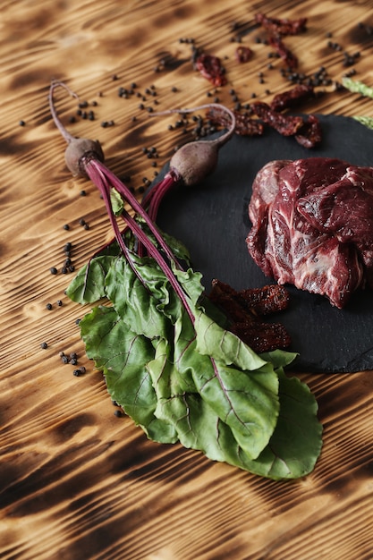 Raw meat with ingredients for cooking meal