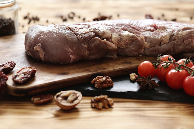 Raw meat with ingredients for cooking meal