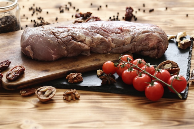 Raw meat with ingredients for cooking meal