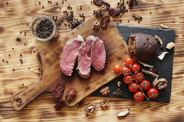 Free photo raw meat with ingredients for cooking meal