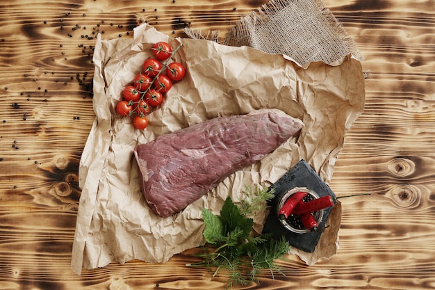 Raw meat with ingredients for cooking meal