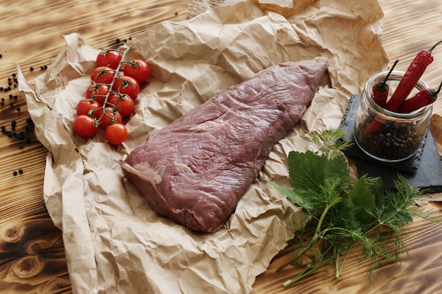 Raw meat with ingredients for cooking meal