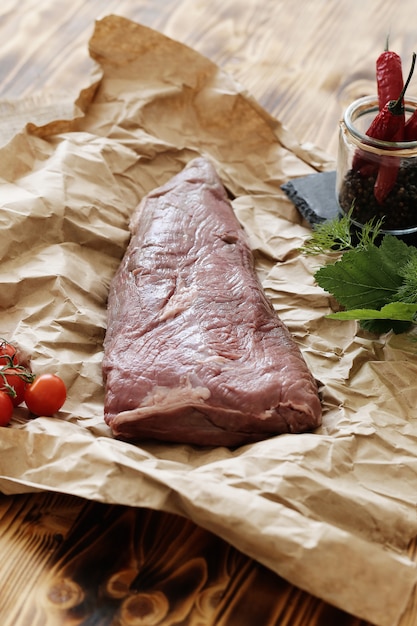 Free photo raw meat with ingredients for cooking meal