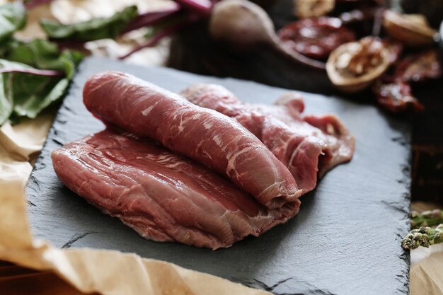 Raw meat with ingredients for cooking meal