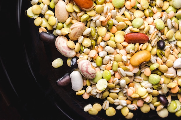 Raw mixed beans in a black plate