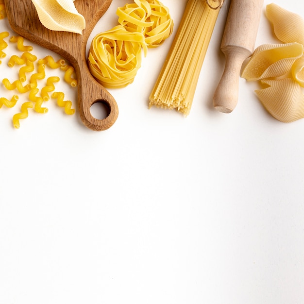 Raw pasta assortment with copy space