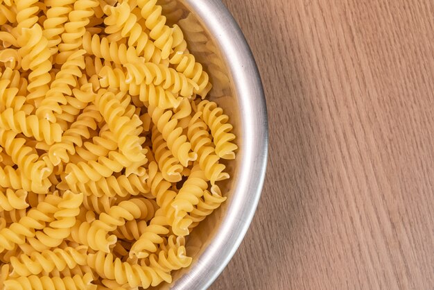 Raw pasta in bowl - macro detail