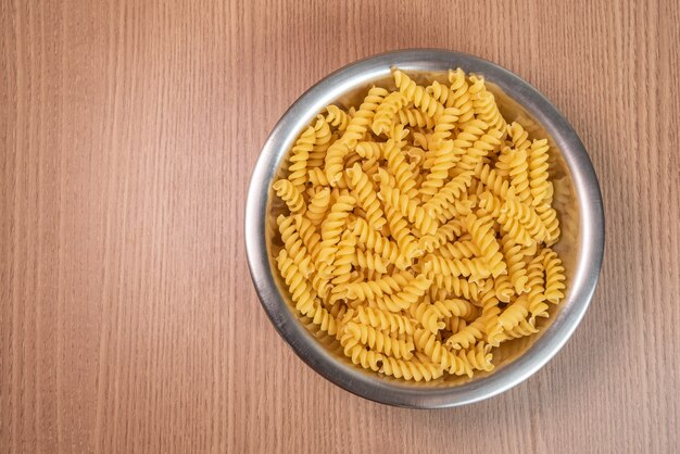 Raw pasta in bowl - macro detail