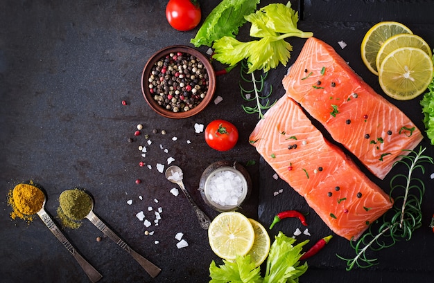 Raw salmon fillet and ingredients for cooking