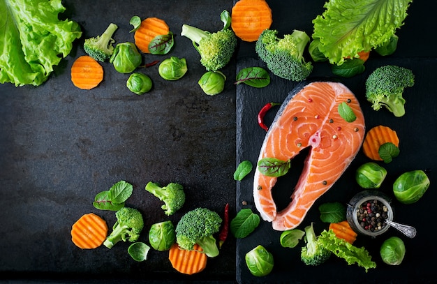 Free Photo raw salmon steak and ingredients for cooking. top view