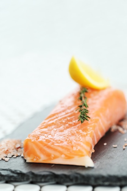 Free Photo raw salmon with pink salt and rosemary