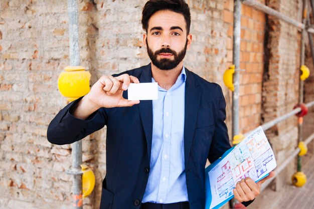 Real estate agent showing business card