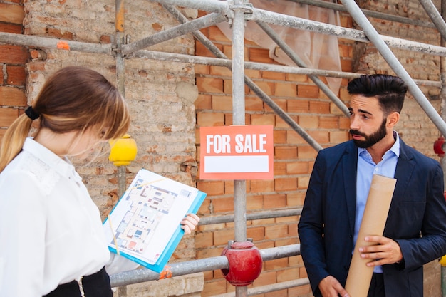 Real estate agents at construction site