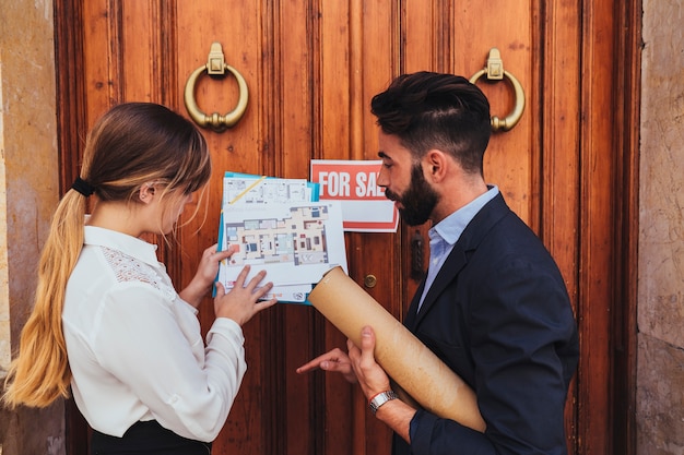 Free Photo real estate agents working at the building's main entrance