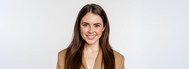 Real professional Smiling businesswoman looking confident determined face expression standing in suit over white background