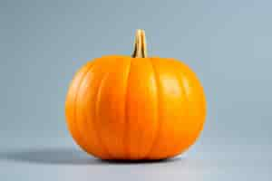 Free photo realistic image of pumpkin on blue coloured background