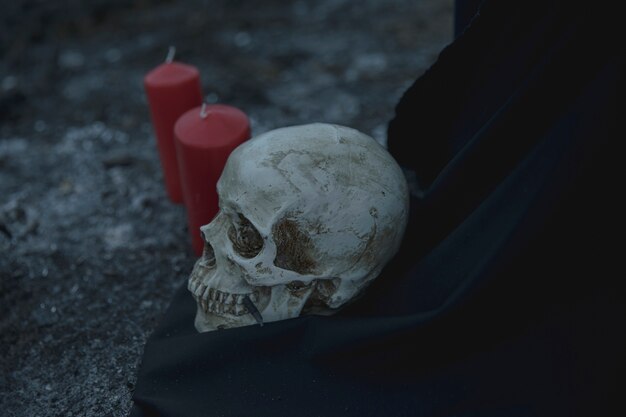 Realistic skull ritual with candles for halloween night