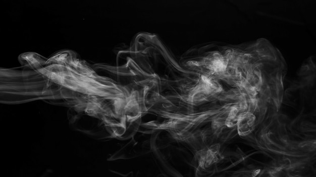 Realistic steam smoke on black background