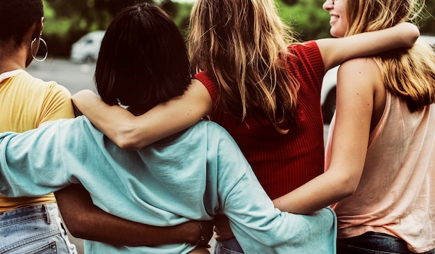 Free photo rear view of a group of diverse woman friends walking together