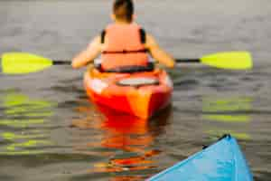 Free photo rear view of man kayaking