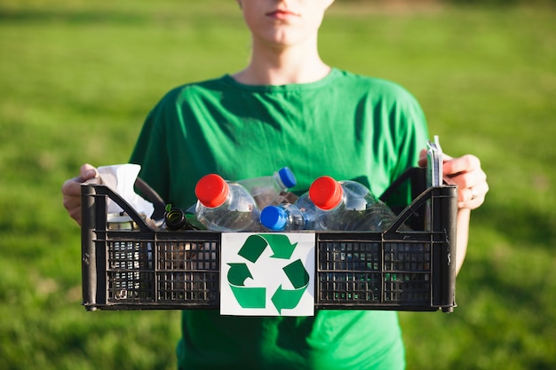 Free Photo recycle background with woman holding box