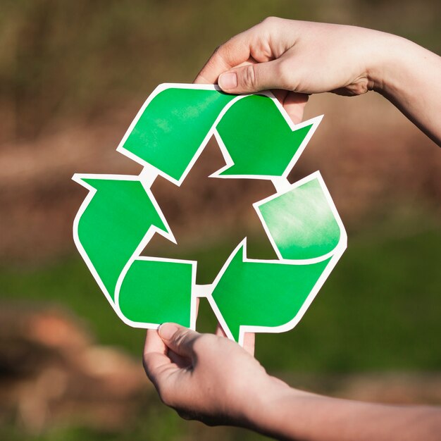 Recycle background with woman holding recycle sign