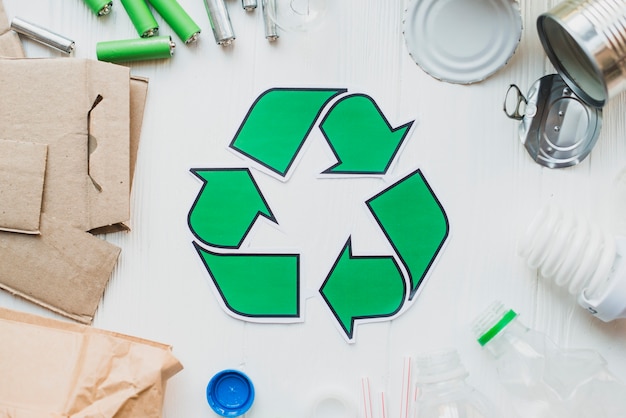 Recycle items on white wooden background