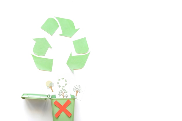 Recycle logo near bin with greenery drawings 