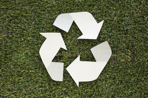 Recycle symbol on grass 