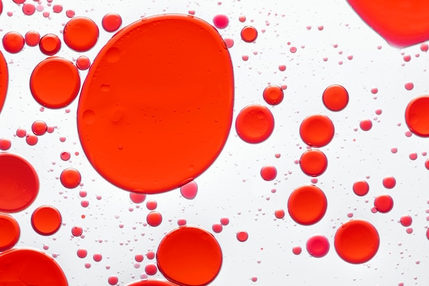 Free photo red abstract background oil bubble in water wallpaper