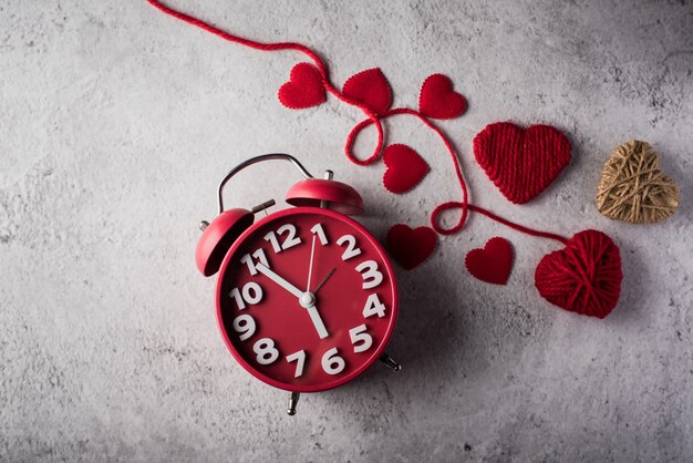 Red alarm clock with Red heart, Valentines day concept.