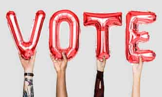 Free photo red alphabet balloons forming the word vote