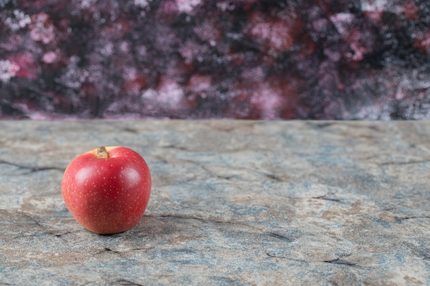 Red apples isolated on concrete surface