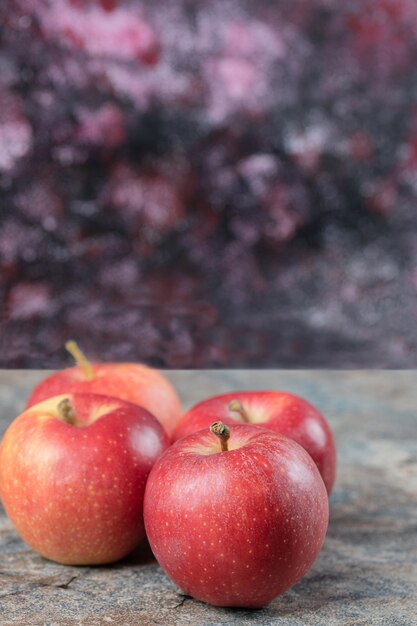 Red apples isolated on concrete surface