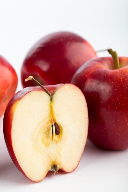 Free photo red apples mellow juicy fresh ripe isolated on white desk