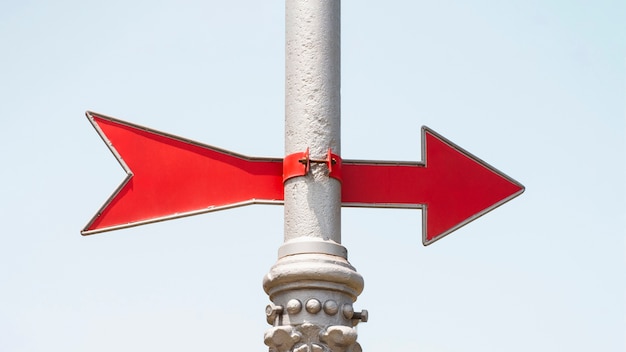 Free photo red arrow direction on a pole