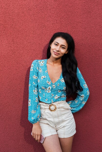 Red background with woman smiling